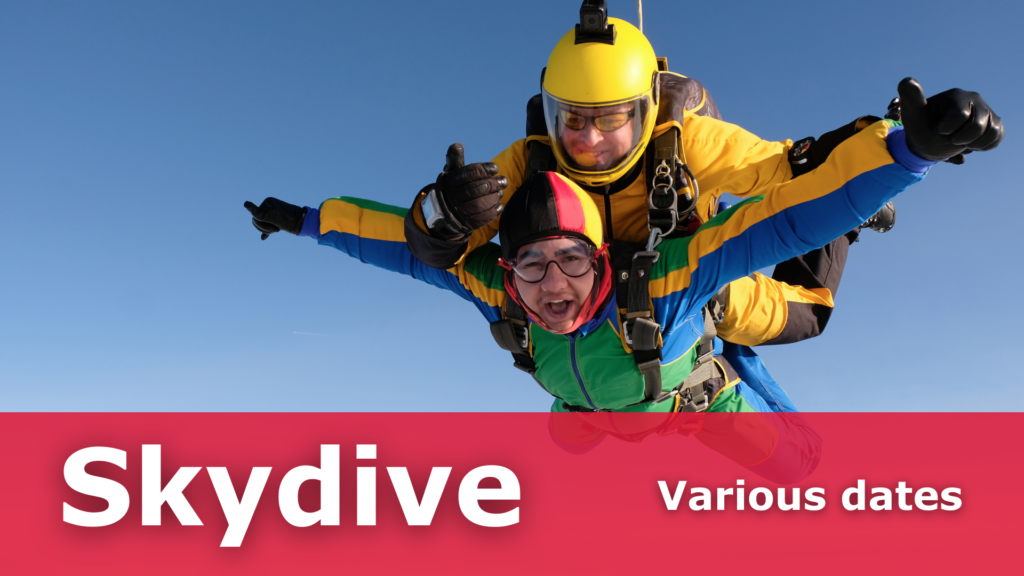 A person has arms outstretched doing a tandem skydive with an instructor attached to their back. Text reads Skydive - various dates.