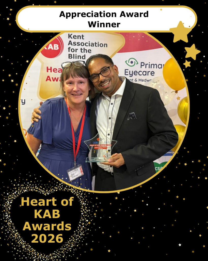 Appreciation winner, Kishan, is holding his trophy and hugging KAB's Children's Worker Nicola.