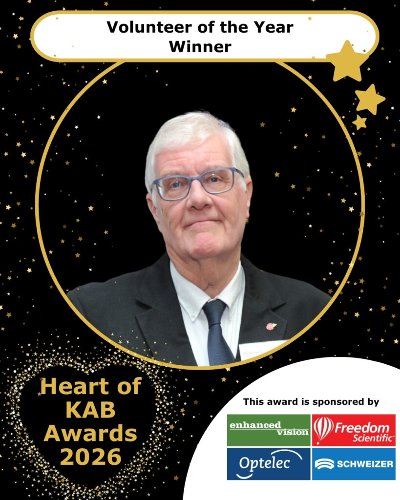 David smiles to camera as volunteer of the year winner.